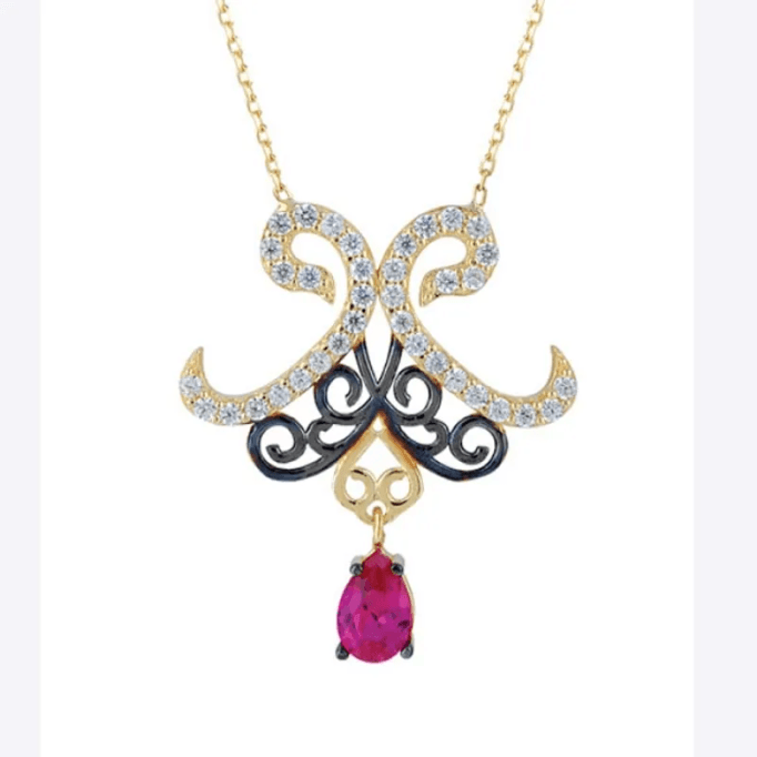 İki Vav Figürlü Mor Damla Taşlı Kolye